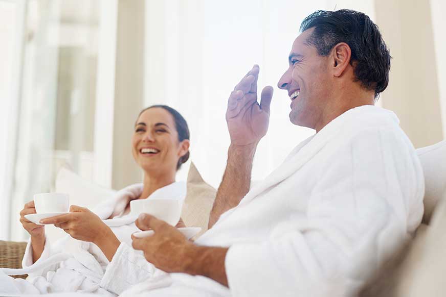 Couple in white robes at SPA at The Residences at The St. Regis Longboat Key Resort