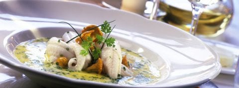 Fresh fish beautifully plated for dinner at The Residences at The St. Regis Longboat Key