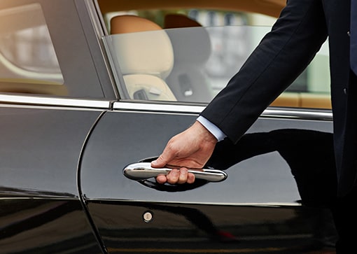 Man opening the car Door at The Residences at The St. Regis Longboat Key Resort