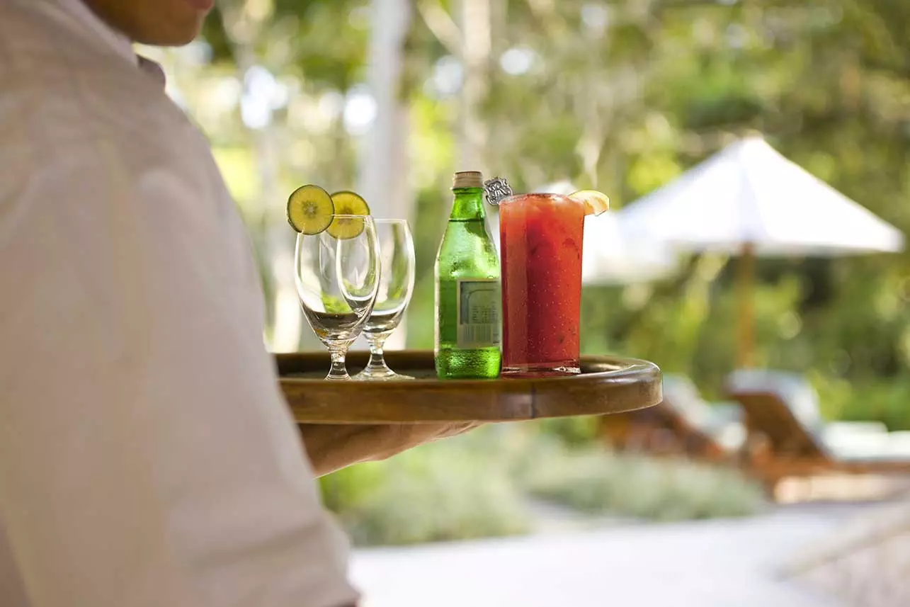 Waiter with a beverage tray at The St. Regis Longboat Key